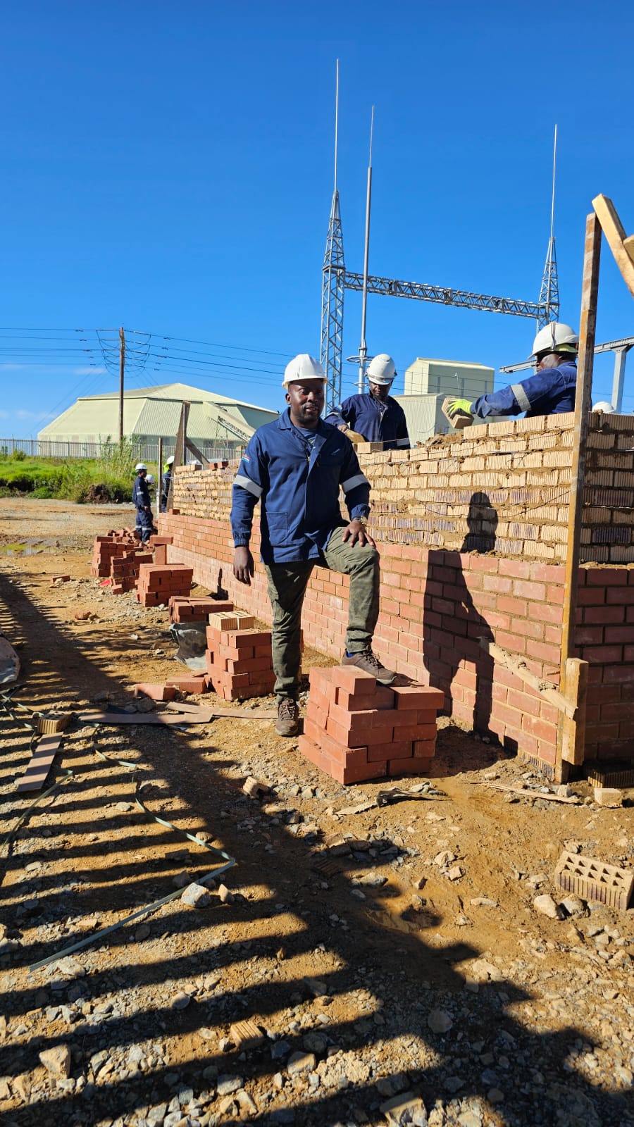 Construction crew building wall