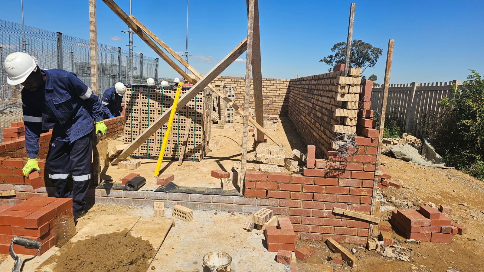 Worker laying bricks