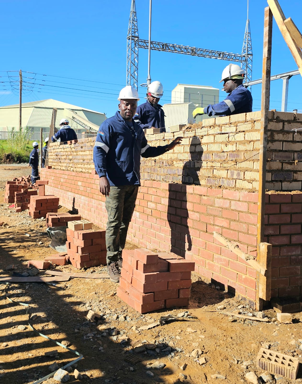 Team bricklaying on site